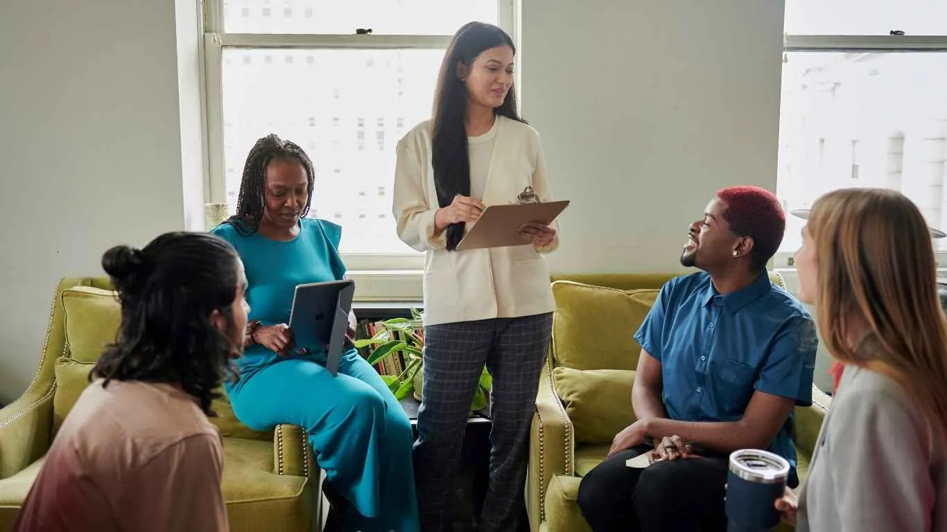 A manager encouraging an employee during a supportive workplace conversation.